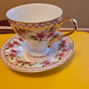 VINTAGE NANTUCKET HOME  PORCELAIN TEACUP AND SAUCER GOLD HANDLE